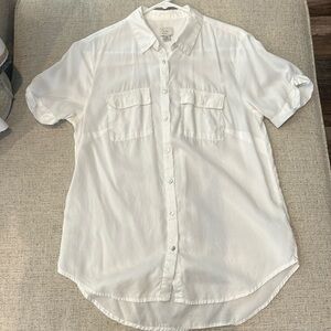 A new day, white, short- sleeve shirt.